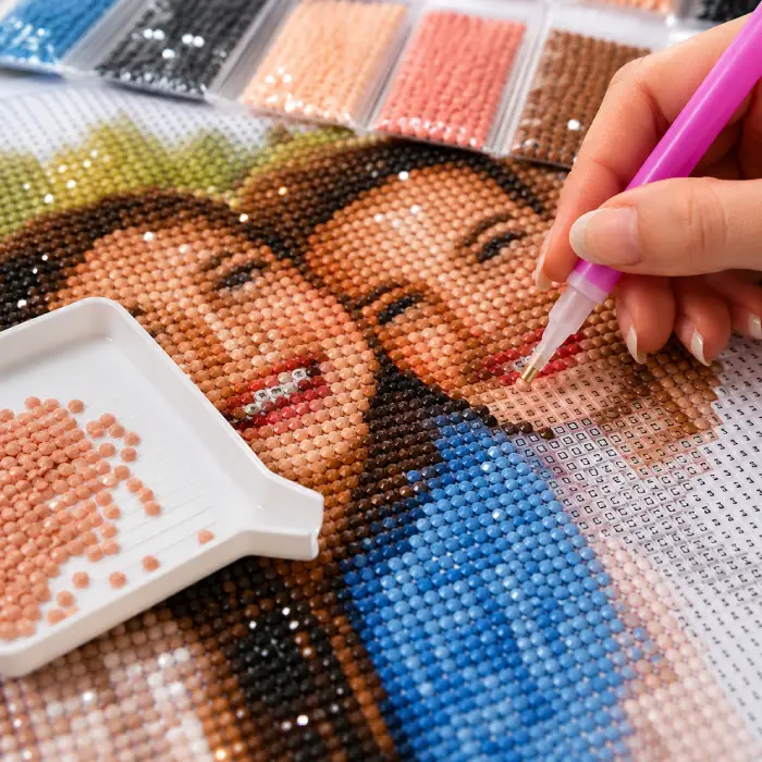 Pose des diamants sur une toile de diamond painting personnalisée à partir d'une photo
